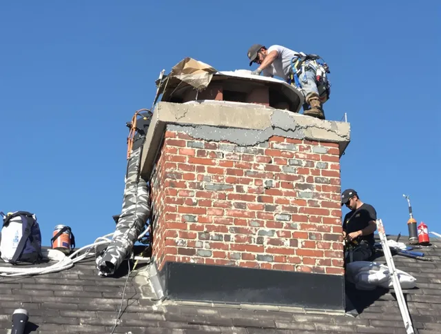 Willowick Chimney Sweep installing a custom chimney crown in Willowick, OH
