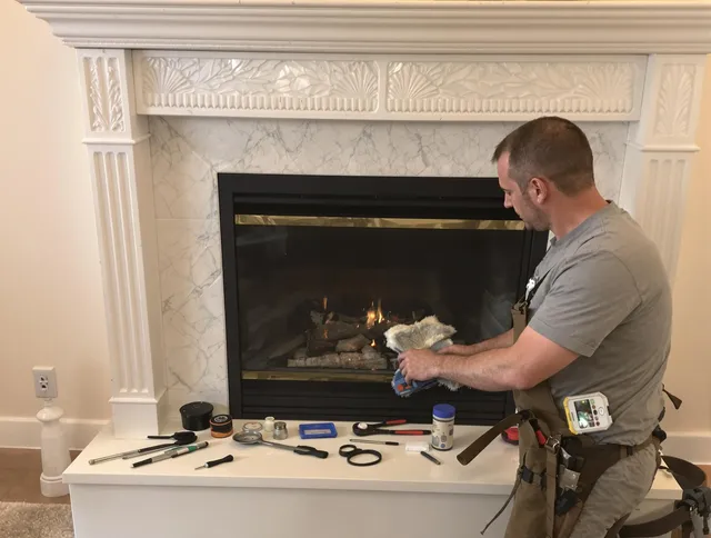 Willowick Chimney Sweep performing fireplace maintenance in Willowick, OH