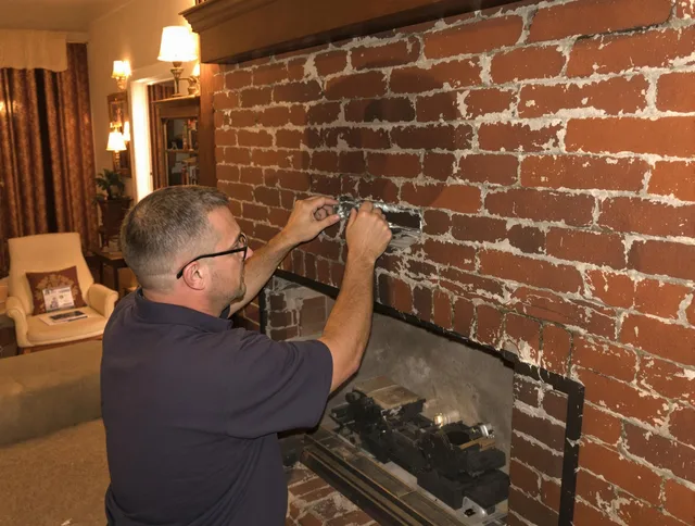Willowick Chimney Sweep expert fixing a fireplace in Willowick, OH